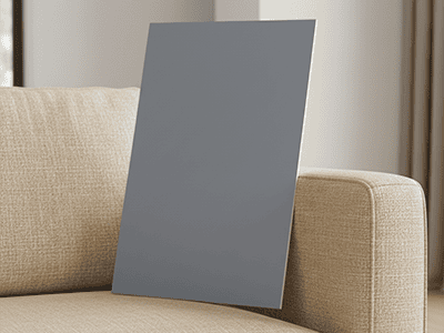 A paint colour sample board clashing badly with the colour of a sofa.