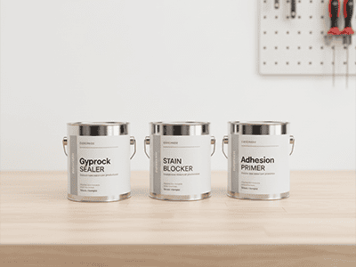Several Australian paint cans showing the words Primer, Sealer, and Undercoat on the labels.